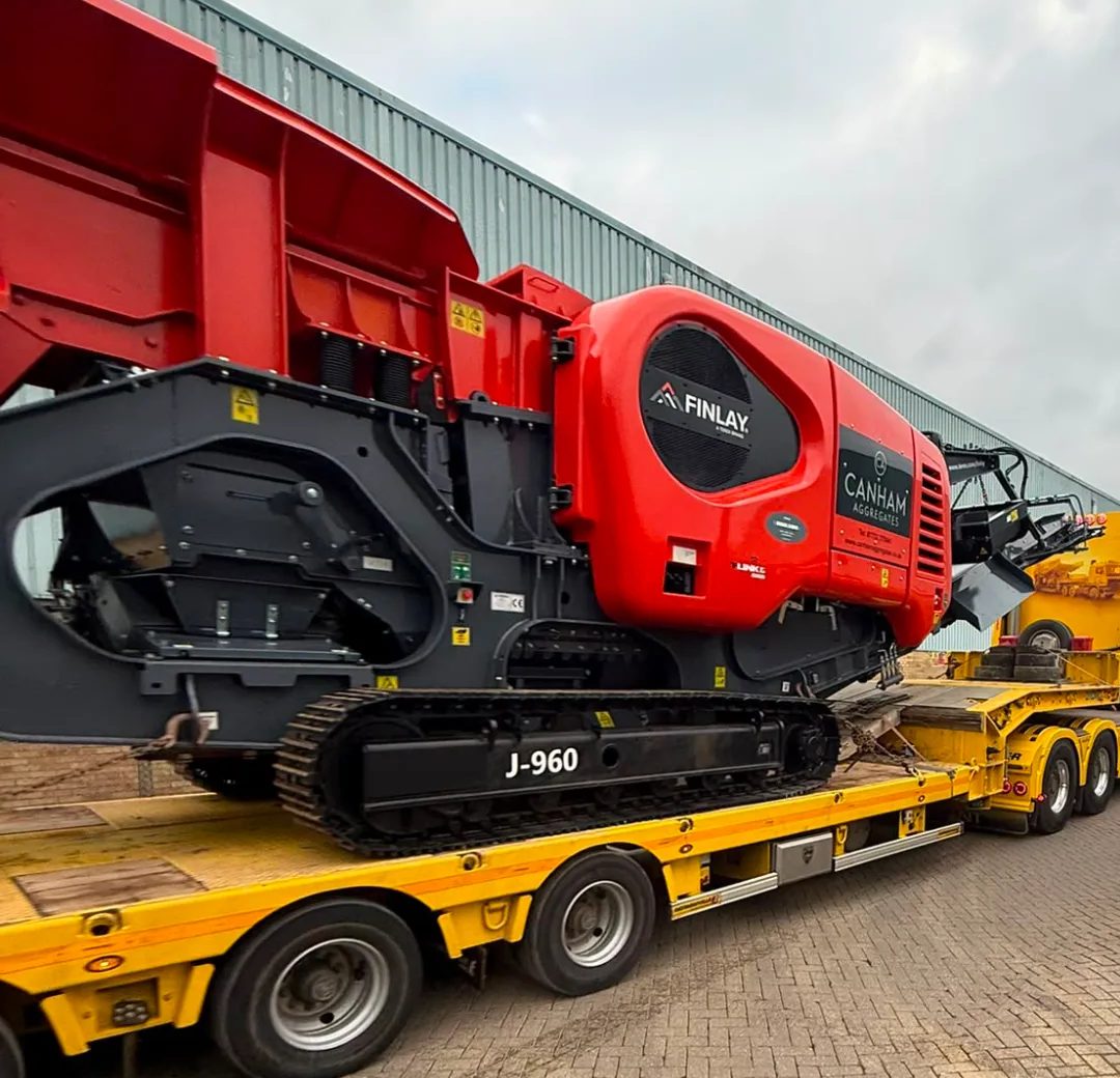 Mobile Finlay J-960 jaw crusher delivered to site on a low-loader