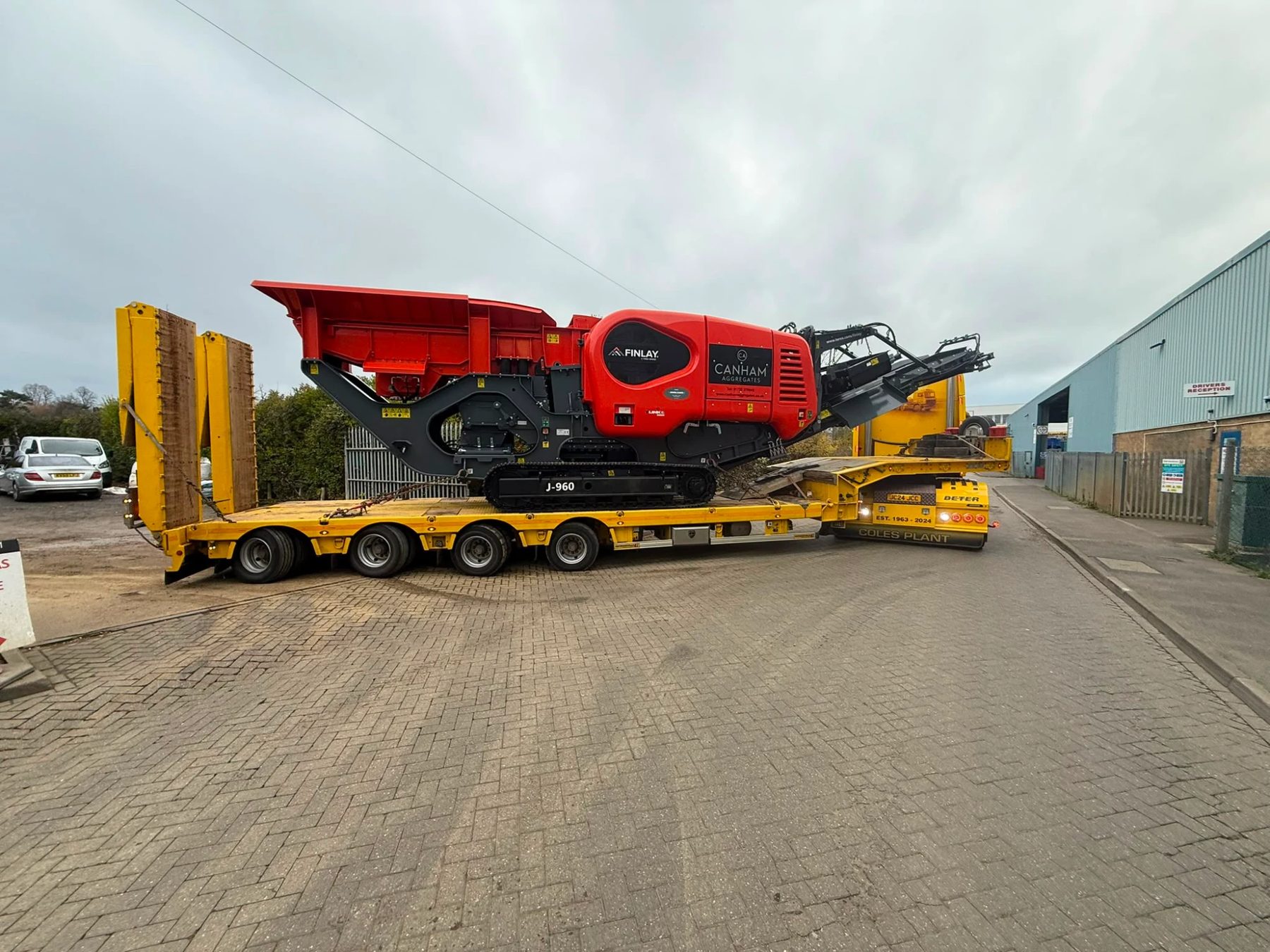 Finlay J-960 mobile jaw crusher on a lowloader for concrete crusher hire in Kent